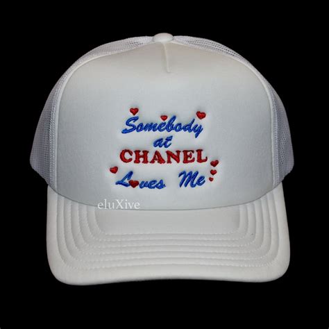 Mega Yacht Somebody at Chanel Loves me hat 